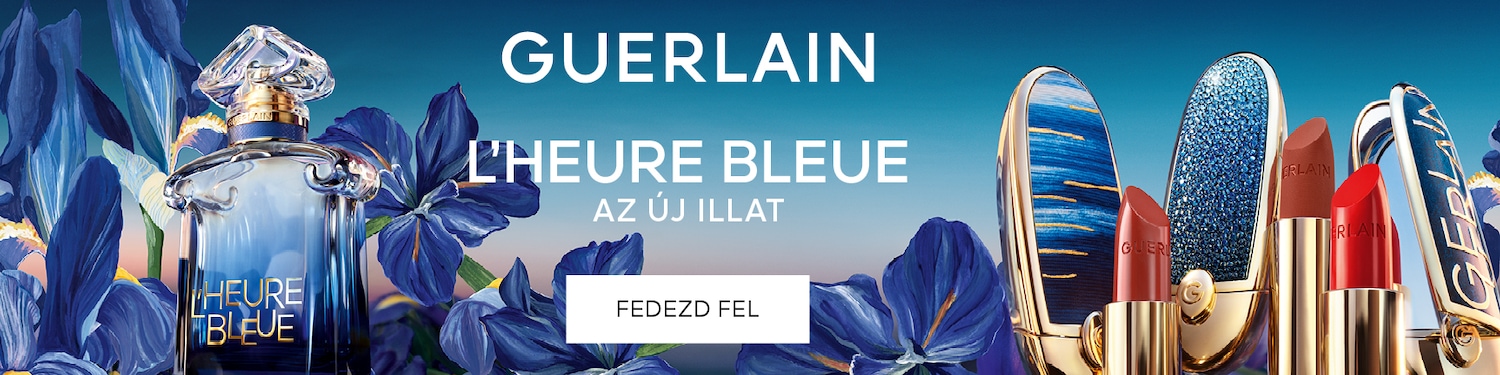 A Guerlain L'Heure Bleue parfüm egy elegáns, kék üvegben, kék íriszvirágokkal körülvéve, a háttérben a Guerlain felirattal és az "AZ ÚJ ILLAT" szöveggel.