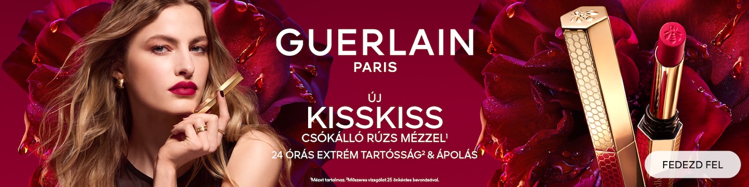 Hirdetés a Guerlain Paris új KissKiss ajakrúzsához, mely csóktálló és mézzel készült, 24 órás tartósságot és ápolást biztosít, a képen egy modell látható, aki a rúzst tartja, a háttérben pedig vörös rózsák vannak, fedezd fel!